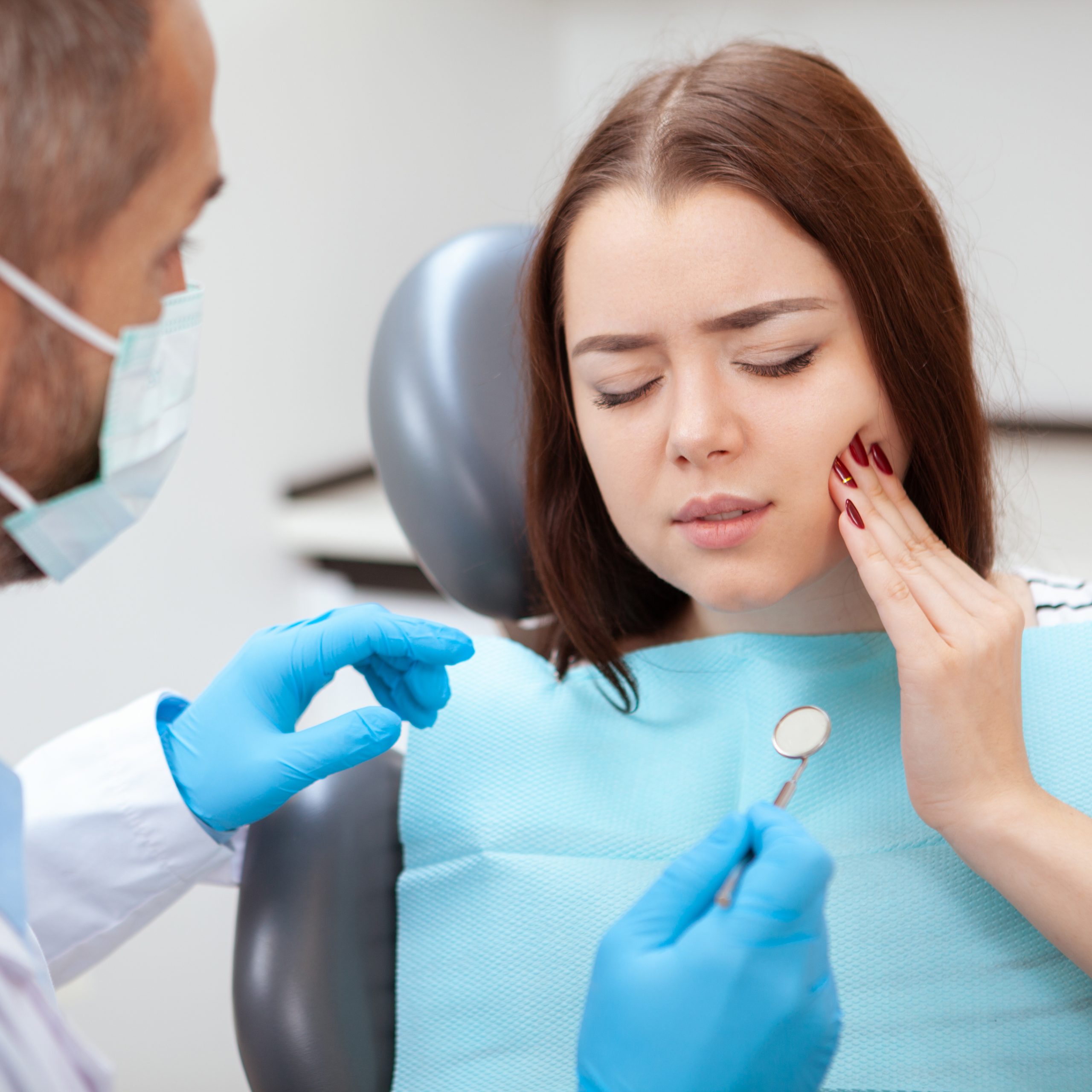 Emergency Dentist Norwich Visit for young woman visiting dentist for medical checkup